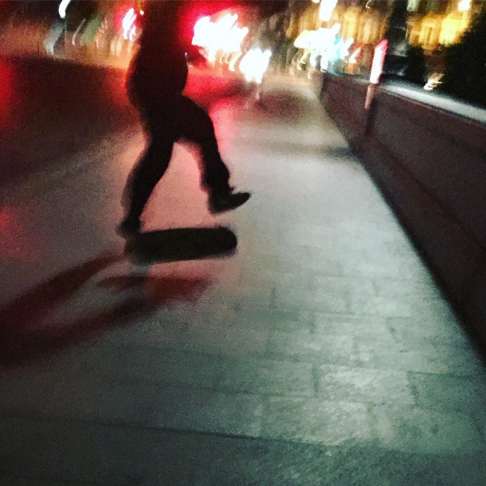 Some guy skateboarding on Putney Bridge