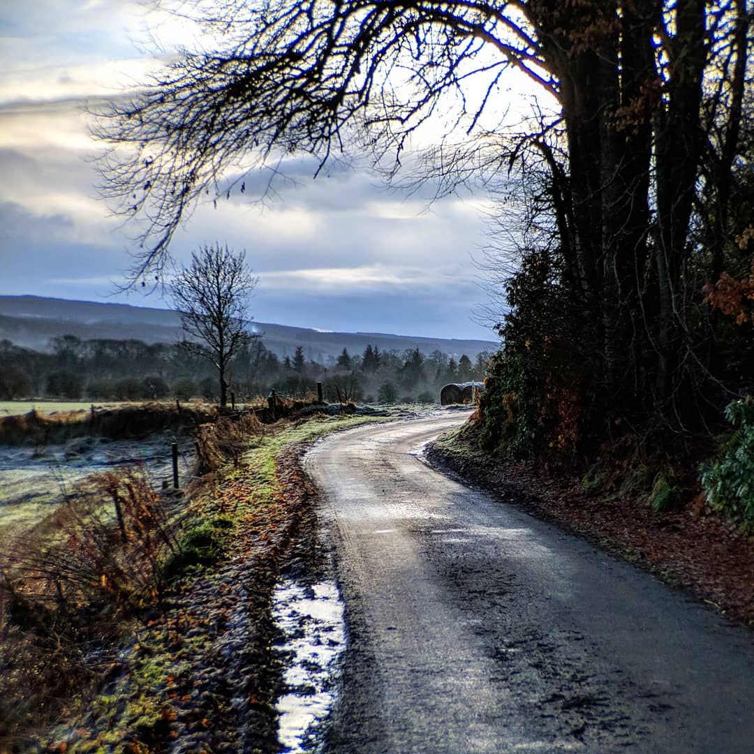 I've got a bit of a thing for roads and paths trailing off-screen. This was a new walk along the river west of Beauly today. This small road was a solid sheet of ice on the way out but almost completely thawed by the way back.

