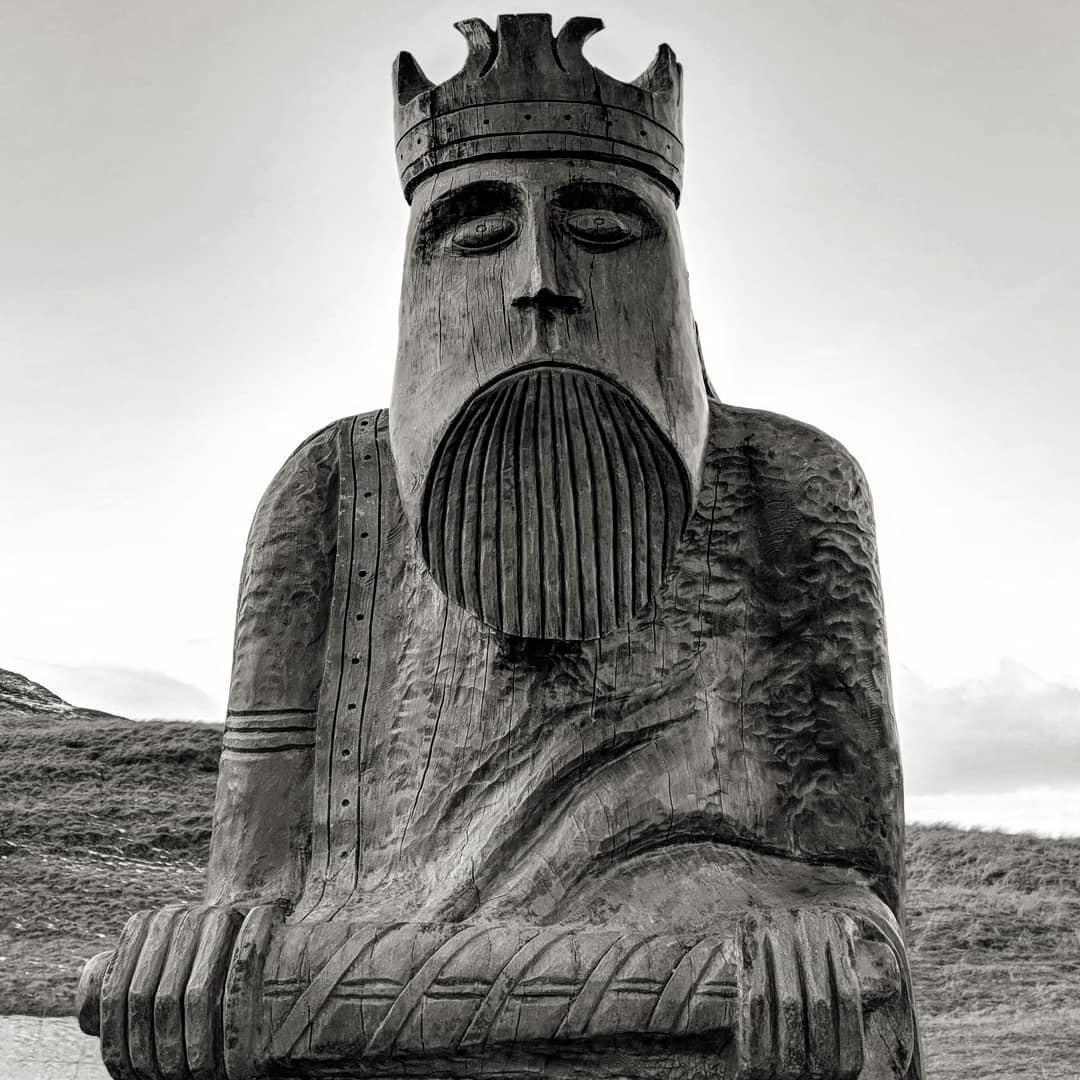 This is a massive sculpture of one of the Lewis chessmen. Only here in Uig, they're called the Uig chessmen. There's a storm outside and dad is playing internet chess.