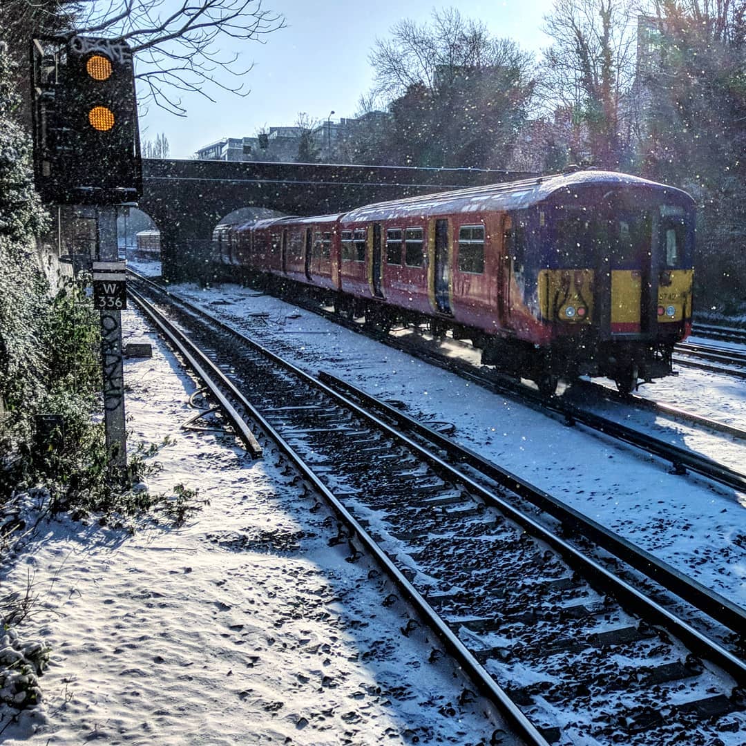 Trains and snow coexisting in imperfect harmony