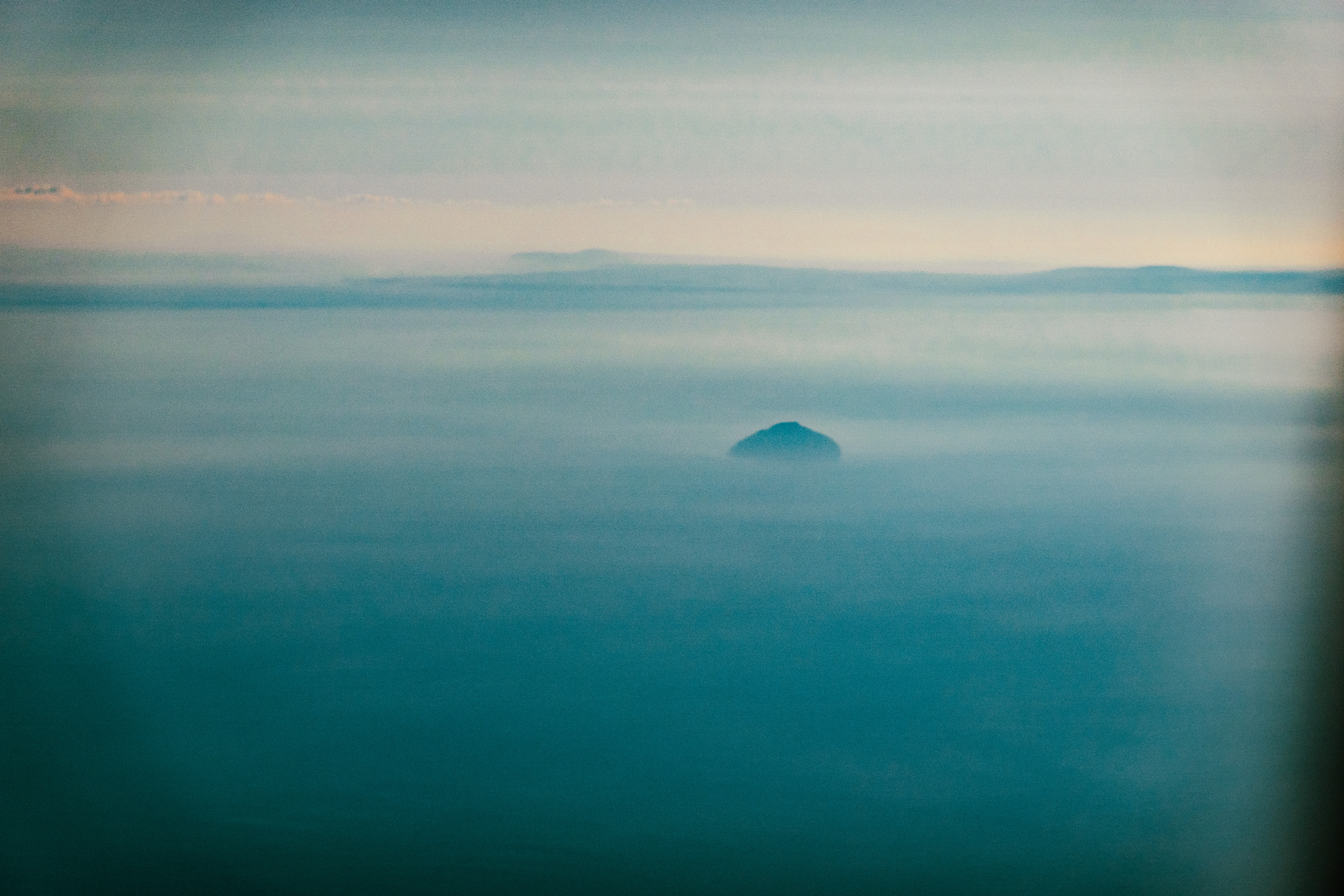 Sometimes it's fun to have a zoom lens, this is [AilsaCraig](https://en.wikipedia.org/wiki/Ailsa_Craig). Remember seeing it from the ferry as a kid.