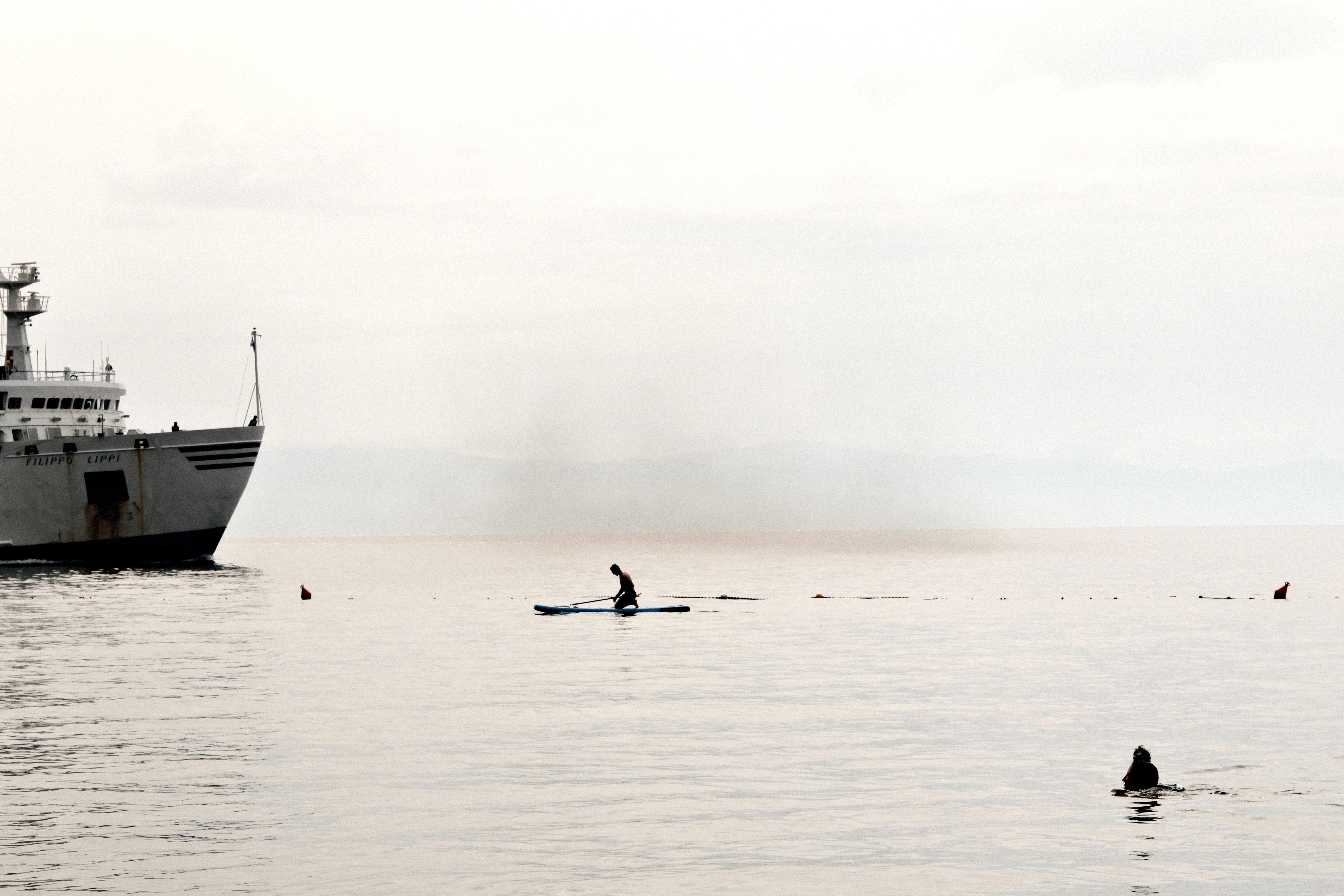 Rinella, sea, SUP, ships, swimmers and smoke.