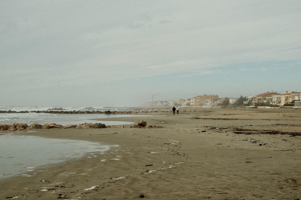 Morning talk beach wave sea rock sand town 